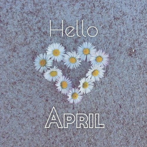 there are daisies arranged in the shape of a heart on the ground with words hello, april