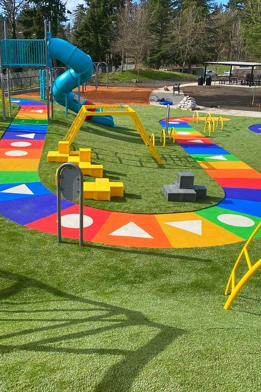 an artificial playground with colorful play equipment