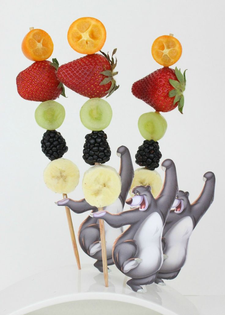 there are fruits on sticks with fruit in the shape of elephants