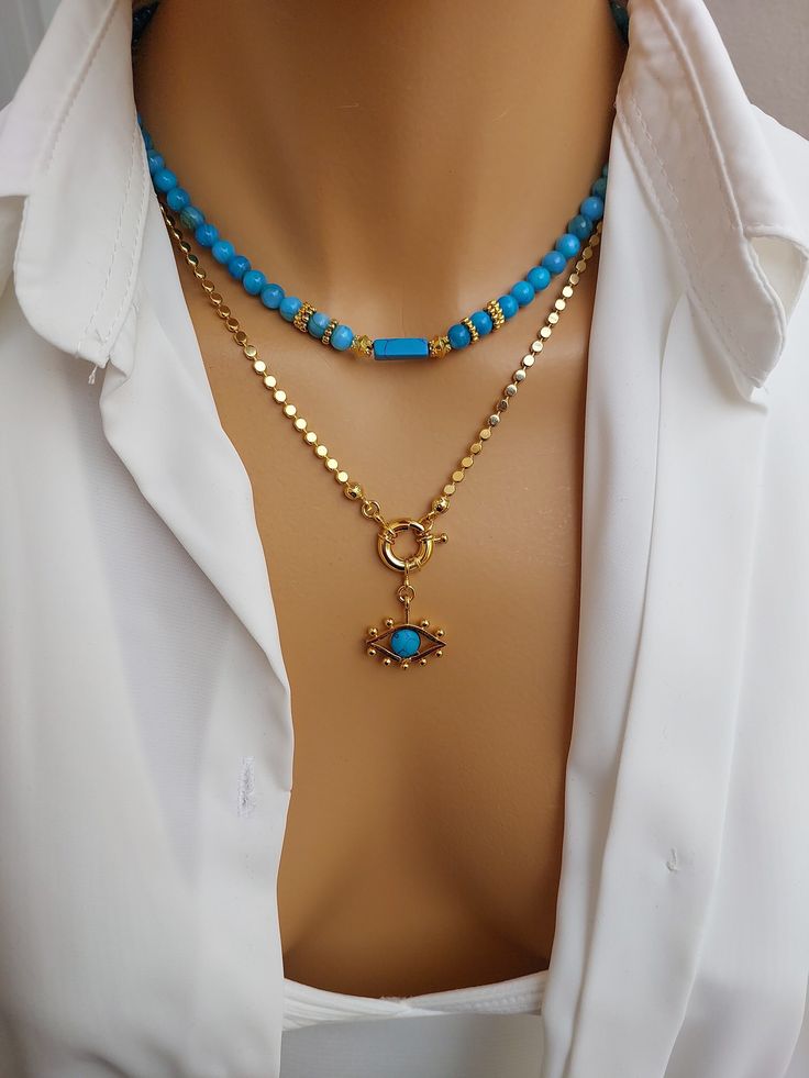 The gold-plated Turquoise stone motif necklace and gold-plated turquoise eye detail pendant with chain in our set emphasize the originality and aesthetics of each piece. It is a modern precious semi-natural stone necklace for women, handmade in turquoise color with a stylish and elegant look. Our gold-plated chains are durable and rustproof, always keeping their shine. Sizes from small to large: Turquoise semi-natural stone bead size: 42 cm (16.53 inches) Turquoise eye-tipped chain size: 53 cm ( Bead Necklace With Pendant, Turquoise Gold-plated Necklace With Adjustable Chain, Turquoise Gold Plated Necklace With Adjustable Chain, Gold Beaded Turquoise Pendant Necklace, Gold Turquoise Necklace With Beaded Chain As Gift, Eye Detail, Turquoise Eyes, Eye Pendant Necklace, Eye Details