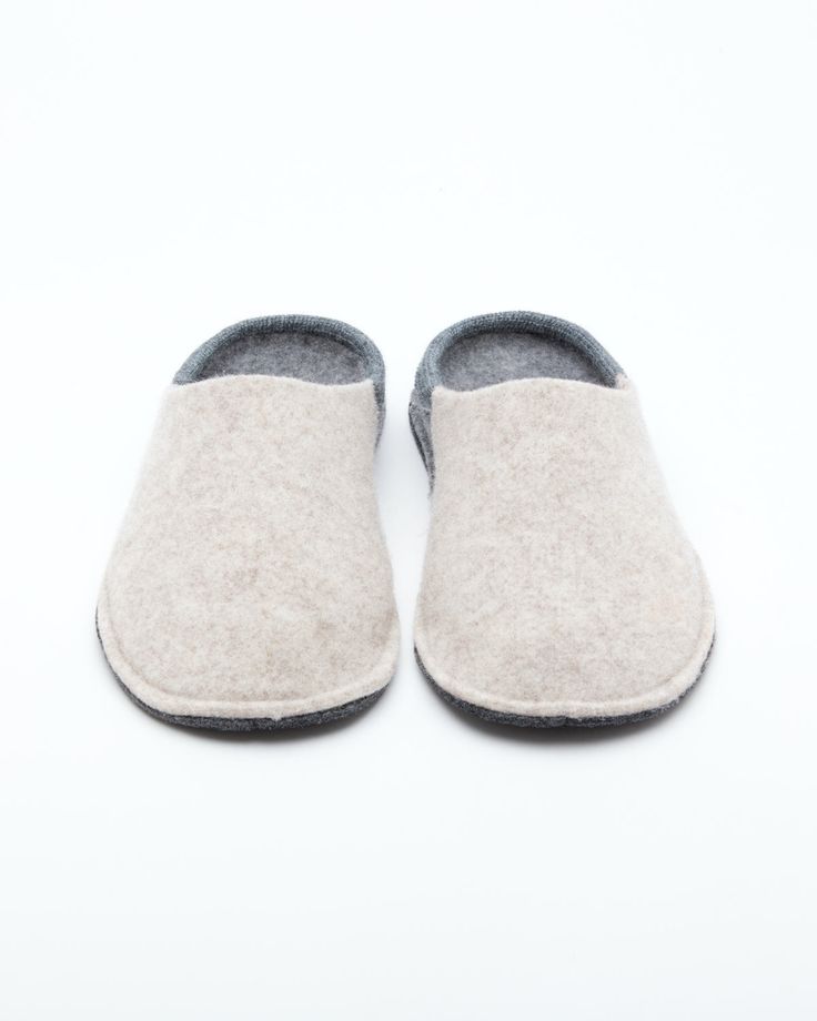 Description: The Nuvola Bico in beige and grey is our soft clog slipper, fully crafted in wool with a 1.5 cm interior heel height EVA insole for added comfort. The Nuvola retains the look of a slipper with the cushioned feel of a sneaker. Designed for the perfect amount of support and feather lightweight, Nuvola feels almost like walking on a cloud. Details: 100% Wool felt upper Two tone design: Colored front with light grey rear and insole Removable 1.5 cm interior heel height EVA insole - for Beige Slip-on Comfortable Slippers, Comfortable Clogs With Textured Sole And Flat Heel, Casual Wool Slip-on Slippers, Beige Flat Clogs With Cushioned Footbed, Casual Wool Slippers With Round Toe, Winter Beige Closed Toe Clogs, Comfortable Beige Clogs With Flat Heel, Casual Wool Slippers For Winter, Cozy Gray Slippers With Round Toe