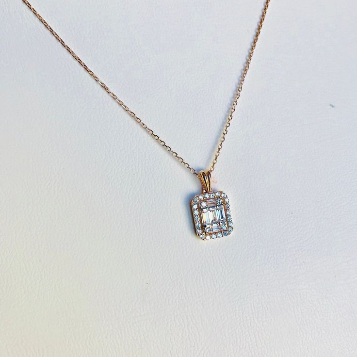 This Cubic Zirconia Necklace is from 14K Solid Gold. It is not filled or plated item. There are baguettes and round cz cubic zirconia stones on setting. charm wide : 8mm charm high : 19mm chain lenght : 17 inches ( standart lenght) Available Gold Options; 14K Gold 14K Rose Gold 14K White Gold White Gold Necklace With Baguette Diamonds For Gift, Diamond Necklace With Baguette Cut For Gift, Classic Jewelry With Baguette Diamonds As A Gift, Diamond Baguette Cut Necklace For Gift, Classic Necklace With Baguette Diamonds For Gifts, Fine Jewelry Baguette Diamond Necklace Gift, White Gold Baguette Cut Necklace For Gift, Baguette Cut Diamond Necklace With Diamond Accents, Elegant Baguette Diamond Jewelry As Gift