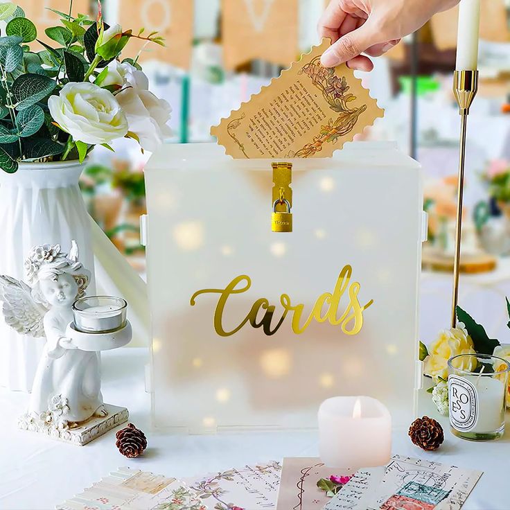 a table topped with lots of cards and candles