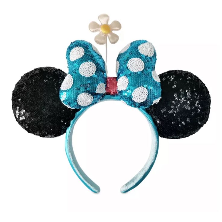 a minnie mouse ears headband with blue sequins and white polka dots on it