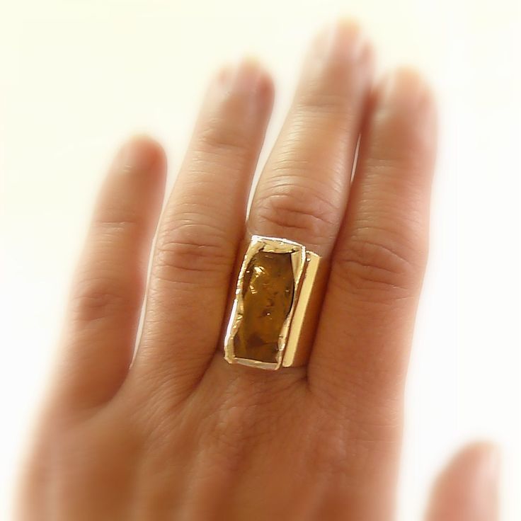 Raw Citrine Ring, November Birthstone Ring, November Birthstone, Citrine Jewelry, Gift, Raw Stone Jewelry, Gold Cuff Ring, Statement Ring. * Beautiful Hand Hammered Citrine Stone, Over a Wide Band Ring * ♣ Stone - Raw Citrine. ♣ Stone size - 2.2 cm. ♣ Metal - Gold plated ( 18k) OR Silver plated - Thick layer of 1 micron, over Brass, Nickel Free. ♣ Ring - adjustable, can fit any size. ring width - 0.8 inches , 2 cm. ♣ Beautifully packaged, ready for gift giving. ♣ Each piece is made by hand solde Gold Cuff Ring, November Birthstone Ring, Raw Stone Jewelry, Raw Citrine, Citrine Jewelry, Wide Band Ring, Squash Blossom Necklace, Squash Blossom, Citrine Stone