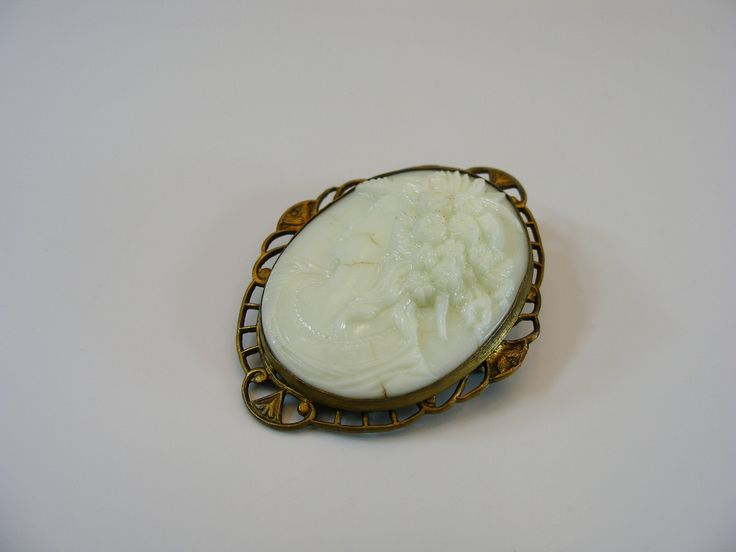 Cameo brooch, oval jewelry, cameo jewelry, filigree jewellery, boho jewellery, body jewellery, antique brooch, opaline brooch, jewelry, uranium jewelry, collectible jewelry, old, cameo --------------------------- Czech vintage opaline uranium cameo brooch. With a locking pin. Size: 1.28" W x 1.64" H  (3.3cm x 4.2cm) In vintage conditions. Please see photos for more details.  Let me know if you'll need more detailed photos. For adult use only - embellishments may have small or pointy parts. Actua Antique Carved Brooches For Weddings, Art Nouveau Cabochon Brooches For Weddings, Art Nouveau Cabochon Wedding Brooches, White Cameo Brooch For Formal Occasions, White Cameo Brooches For Formal Occasion, Elegant Carved Brooches For Gifts, White Ornate Brooch For Formal Occasions, White Ornate Brooches For Formal Occasions, Ornate White Brooches For Formal Occasions