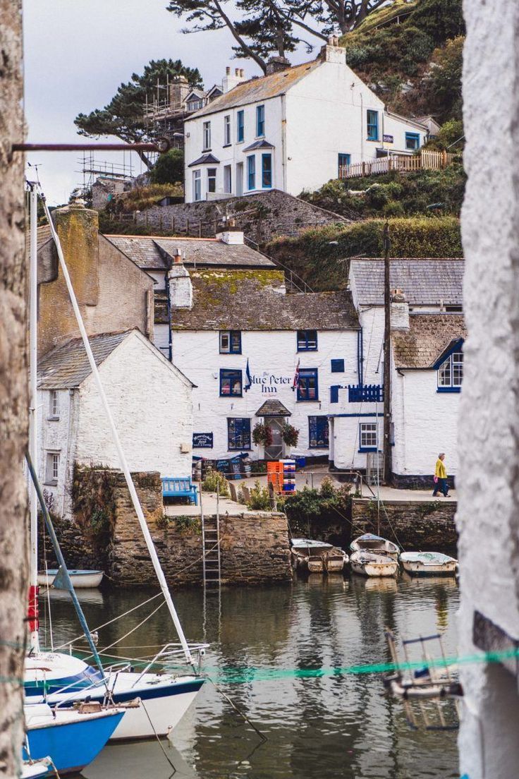 boats are docked in the water next to houses