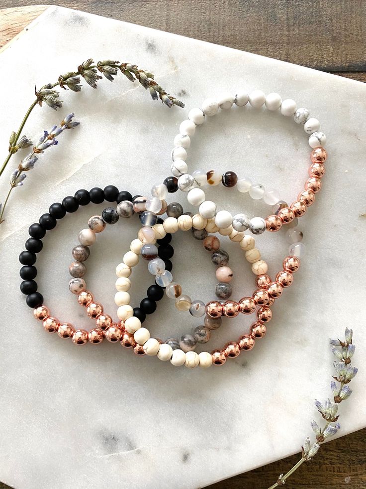 4 mm hematite rose gold beads with your choice of 4 mm stone beads.  If unsure on size measure your wrist and choose a size .5' larger than wrist size. Do not wear bracelets in water. To wear, roll onto wrist and don't stretch it out.  *FREE Shipping on orders over $35 (no coupon needed, USPS First Class Mail). Quick to ship! Spiritual Rose Gold Bracelets With 8mm Beads, Spiritual Rose Gold Bracelet With 8mm Beads, Rose Gold Beaded Bracelets As Gift, Spiritual Rose Gold Beaded Bracelets, Everyday Rose Gold Jewelry With 8mm Beads, Adjustable Rose Gold Spiritual Beaded Bracelets, Hand-strung Rose Gold Beaded Bracelets As Gift, Rose Gold Beaded Bracelets With Gemstones As A Gift, Stackable Rose Gold Beaded Bracelets