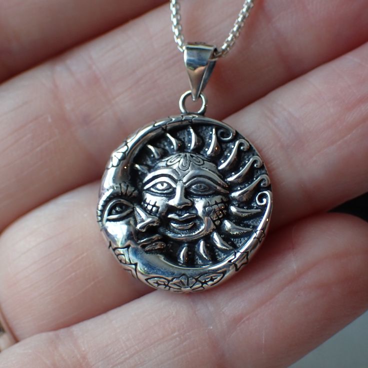 This is a very beautiful sterling silver celestial charm with a detailed sun and moon. It measures 1.1” long including the bail and .8" wide. This charm is photographed on a 1 mm sterling silver rounded box chain which is sold separately. It can be found here. Bohemian Sterling Silver Necklace With Sun And Moon Design, Sterling Silver Medallion With Moon Charm, Celestial Sun And Moon Sterling Silver Necklace, Sterling Silver Moon Charm Medallion Jewelry, Sterling Silver Medallion Jewelry With Moon Charm, Sterling Silver Sun And Moon Spiritual Necklace, Crescent Silver Jewelry With Sun And Moon Design, Celestial Jewelry With Sun And Moon Designs, Bohemian Sterling Silver Jewelry With Sun And Moon Design