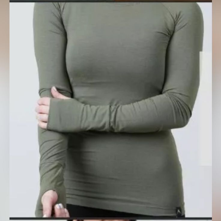 Rokwolf Woman's Workout Lounge Long Sleeve Top Essentials Burnt Olive Green Nwt > Made Of 97% Pima Cotton And 3% Spandex > French Terry Knit Fabric, Giving You Warm And Comfort > Perfect For Colder Weather > Stretchable, Super Soft > Beautiful Fabric > Versatile Top (Can Be Worn As Pajamas, Working Out, Or Athletic Wear Depending On Your Preferences) Color: Burnt Olive/Green Fitted Green Winter Activewear, Fitted Green Activewear For Winter, Fitted Yoga Tops For Winter, Winter Yoga Fitted Tops, Green Functional Tops With Thumbholes, Functional Stretch Top For Winter, Winter Yoga Tops With Thumbholes, Solid Color Tops For Yoga In Winter, Solid Color Yoga Tops For Winter