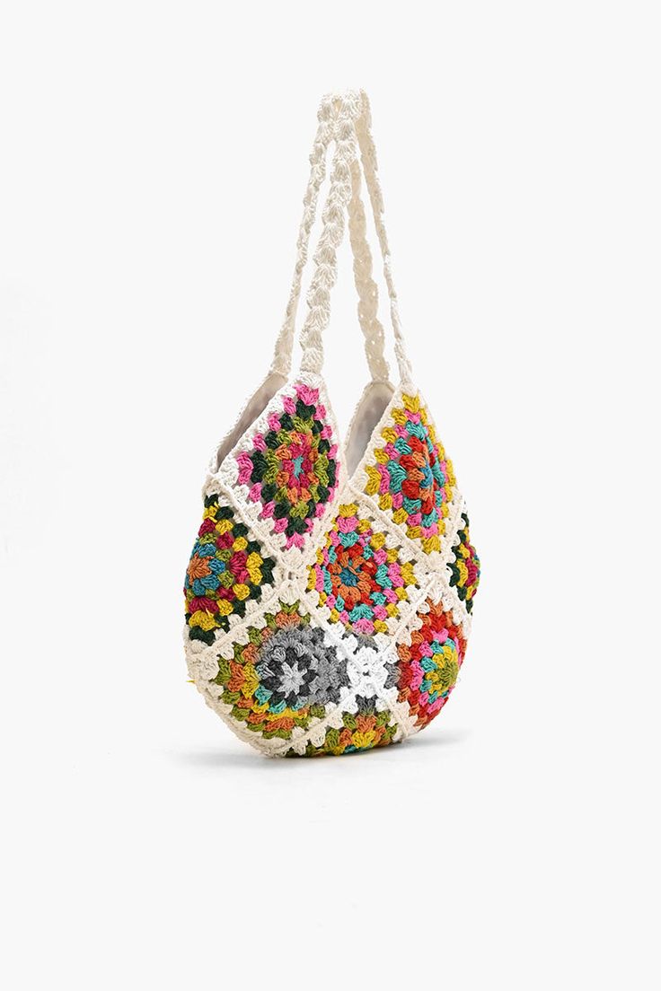 Shoulder bag Crochet Top Handle Colorful floral patchwork from front to back Magnetic button closure Lined interiors with zip pocket Size: 13.5" x 12.5" Embrace your free-spirited style and make a statement with this bohemian-inspired bag that's as practical as it is stylish. The Slouchy Crochet Shoulder Bag is a bohemian-inspired accessory that effortlessly combines style and functionality. Crafted with care and attention to detail, this shoulder bag is perfect for those who appreciate unique a Shoulder Bag Crochet, Animal Print Jumpsuit, Leopard Bag, Weekend Adventures, Crochet Shoulder Bag, Free Spirit Style, Floral Patchwork, Mini Pouches, Eclectic Fashion