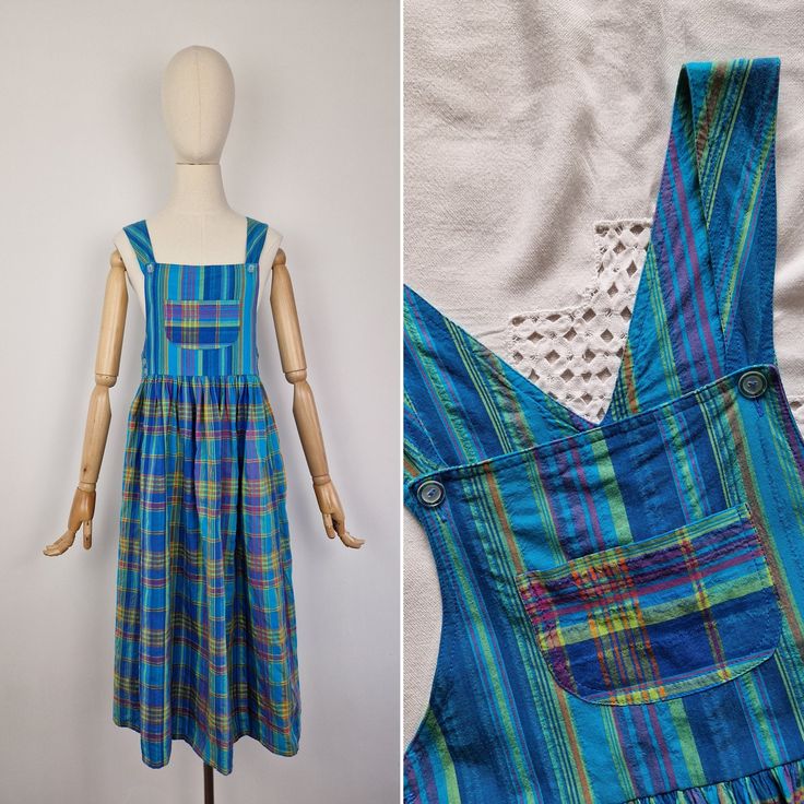 Vintage checked cotton pinafore dress. Has chest pocket and regulated straps. Fastens with buttons at the sides and on the shoulder straps.  Fabric: 100% cotton Brand: Giorgio Selection by Heli Very good vintage condition The modern size is recommendation only, please refer to measurements. Recommended for size UK 10 / small M or smaller depending on desired fit. Mannequin is size UK 6. Appr. measurements (taken laid flat and doubled when applicable): Bust: appr. 37" Waist and above: 31" Shoulde Summer Plaid Dresses With Pockets, Retro Cotton Plaid Dress For Picnic, Casual Cotton Plaid Dress With Buttons, Cotton Sleeveless Pinafore Dress With Adjustable Straps, Casual Cotton Pinafore Dress With Bib Front, Vintage Sleeveless Plaid Cotton Dress, Summer Cotton Plaid Dress With Buttons, Cotton Plaid Dress For Picnic, Cotton Plaid Dress For Picnics