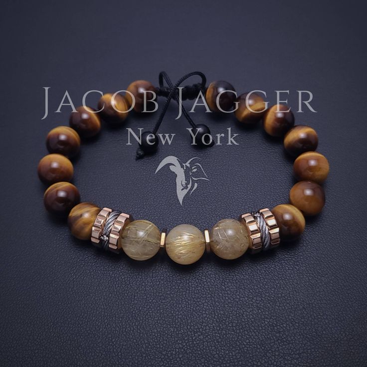 Luxury style gold rutilated quartz and tiger eye bracelet for men or women. Bold big beaded tigers eye mens bracelet made with natural 10mm stone beads and rose gold stainless steel spacer charms. Adjustable length. SIZE GUIDE: Check 5th picture for size instructions. GIFT BOX: Bracelets are shipped in 1 gift box. If you prefer boxes for each bracelet, leave a message BEFORE shipping labels are created. Luxury Gemstone Beads Jewelry For Healing, Luxury Healing Gemstone Beads Jewelry, Luxury Gemstone Beads Bracelets For Healing, Luxury Adjustable Gemstone Beads Jewelry, Elegant Brown 8mm Bead Jewelry, Elegant Brown Jewelry With 8mm Beads, Luxury Round Gemstone Bead Bracelets, Luxury Gold Bracelets With Gemstone Beads, Luxury Gold Beaded Bracelets With Gemstones