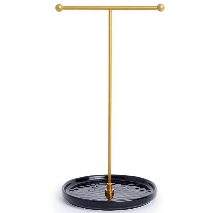 a black tray with a gold handle on it and a metal bar in the middle