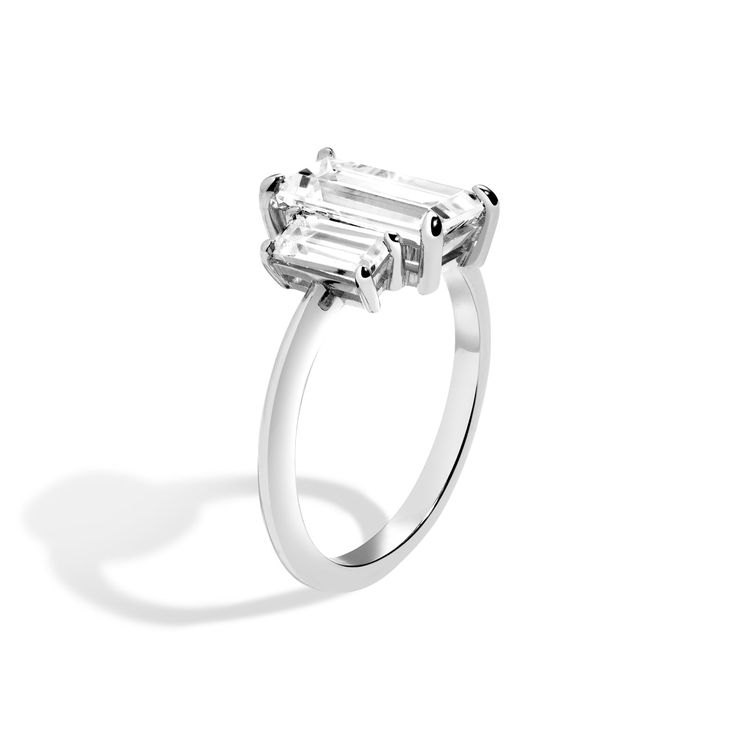 The 2020s engagement ring series is about restraint and paring down the unnecessary, leaving behind only what is the most important. The 3-Stone series, gives a nod to deco design, reimagined for the 2020s. Shedding excess details, our signature soft knife edge draws the eye to the trio of carefully balanced diamonds in each ring. Set low and flush to the finger, the 3-stone setting is designed with comfort in mind. Claw-set baguette center is flanked by a set of .40 carat baguette diamonds. Set Shahla Karimi, Baguette Ring, Emerald Cut Rings, Baguette Diamonds, Double Ring, Stone Setting, Baguette Diamond, Recycled Sterling Silver, 1 Carat