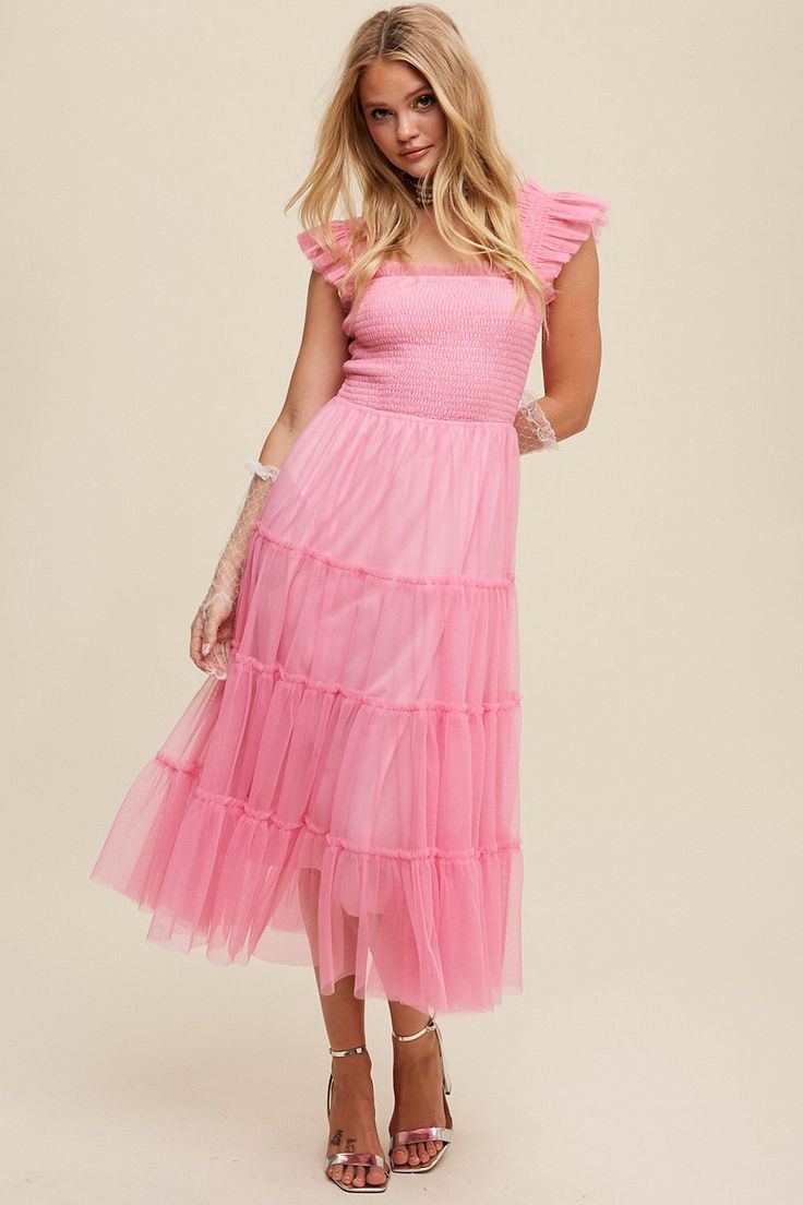 Get ready to make a statement with the Eras Maxi Bubblegum Pink dress! This smocked ruffle tiered mesh dress features a unique smocking detail on the body and shoulder straps, giving you a flattering and playful silhouette. The tiered skirt and raw hem add extra flair to this lined maxi dress. Stand out from the crowd with this quirky and fun fashion choice! Pastel Dress Casual, Bubblegum Pink Dress, Pastel Dress, Dress Stand, Wildflower Garden, Put A Ring On It, Bubblegum Pink, Fun Fashion, Tiered Skirt