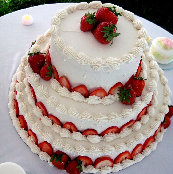 a triple layer cake with strawberries on top is displayed in an image from the website