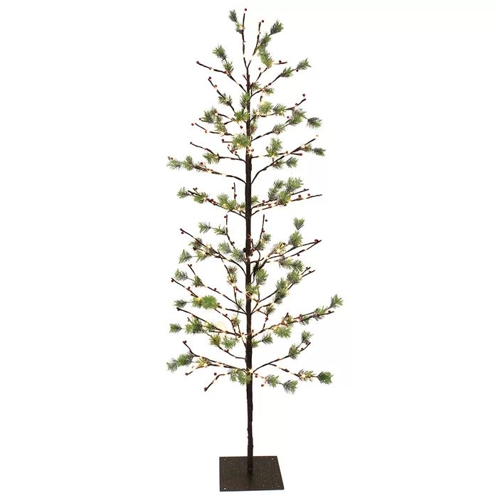 a small pine tree with white lights in a black square base on a white background