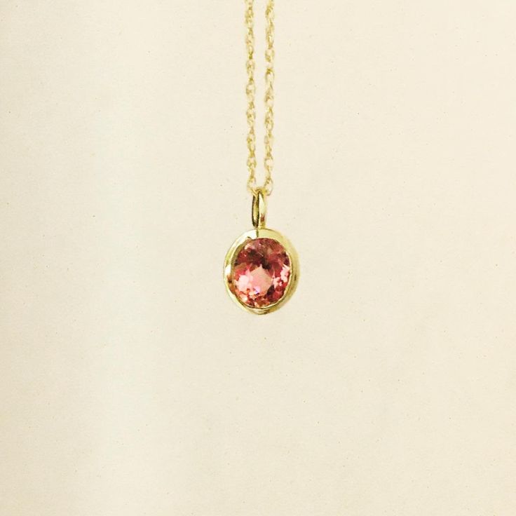 MELIGreece's elegant pendant with a pink oval-shaped tourmaline weight: 0.74 carats set in a 18k yellow gold chain. Tourmaline is the birthstone of October, an excellent suggestion that pink gemstone 18k solid gold discreet necklace for a fall's birthday gift. Handcrafted in MELIGreece's workshop in Athens. Length of the tourmaline chain necklace: 42.0 cm. / 16.53 inch. Dimensions of the tourmaline : 6.0 * 7.0 mm. / 0.23 * 0.27 inch. Tourmaline gemstone is believed to promote inspiration and cre Rose Gold Chain Necklace, Graduation Necklace, Solid Gold Chains, Turtle Pendant, Elegant Pendant, Elephant Pendant, Pendant With Chain, Minimal Chic, Pink Gemstones