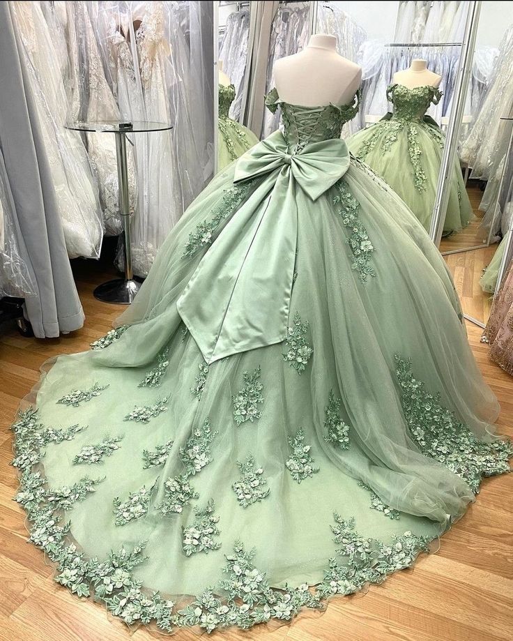 Princess Tiana Dress Quinceanera, Sage 15 Dresses Quinceanera, Sage Green Debut Gown, Sage Green Sweet 16 Dress, Green Quinceneara Dress, Princess Tiana Themed Prom Dress, Tinkerbell Quinceanera Dress, Quinceanera Light Green Dresses, Sage Green Charro Dress