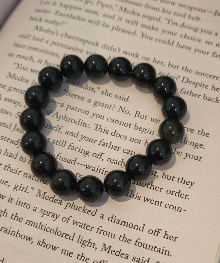 This handmade bracelett is made of black obsidian, which has many benefits including:helps balance all aspects of life- physical, mental, emotional, and spiritual. Black Holistic Beaded Bracelets With Natural Stones, Holistic Black Beaded Bracelet With Natural Stones, Handmade Black Holistic Bracelets, Holistic Black Handmade Bracelets, Holistic Handmade Black Bracelets, Spiritual Obsidian Beaded Bracelets, Spiritual Round Obsidian Bracelets, Spiritual Obsidian Bracelets, Spiritual Obsidian Round Bracelets