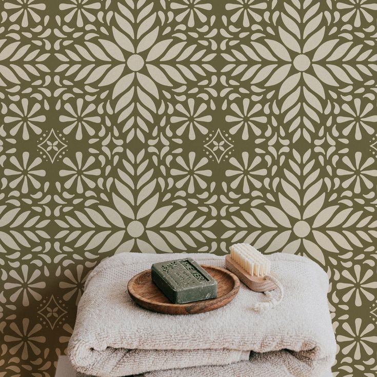 a wooden plate sitting on top of a pile of towels