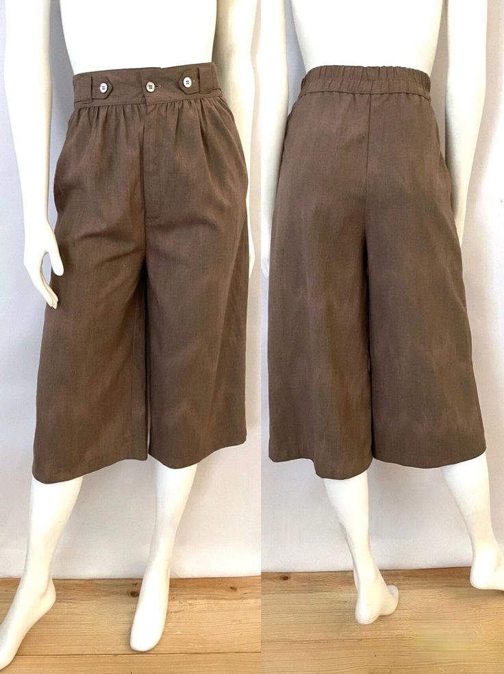 "Vintage 70's/80's Brown, High Waisted, Cropped Pants (M) These Pants come in brown and is high waisted with a half elastic waist (back only) and front zipper and single button closure with front pleats,  a loose, straight fitting leg, two front pockets that sits just over the knee in length. The fabric is soft with a matte surface and does not stretch. Feels like a Cotton/Polyester Blend. No inside tag info-has been cut out. *These pants are in excellent condition. Size: (M) Modern Day 6/8 (Tag Size: 9) Waist: 26\"-28\" Hips: up to 38\" Inseam: 17 1/4\" Total Length: 27\" Rise: 14\" (front) 15\" (back)  Leg Opening: 12\" Weight: 13 oz *Follow Freshandswanky on Instagram" Wide Brown Pants, Brown Straight Leg Pants, Wide Cropped Pants, 80s Pants, 80s Clothes, High Waisted Cropped Pants, Disco Shirt, Brown Trousers, 80s Outfit