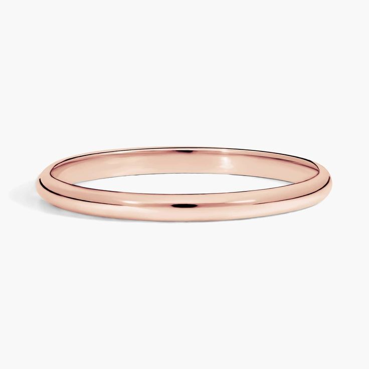 A perfect complement to any engagement ring, this wedding band in 14k rose gold strikes the slimmest outline at only 2mm wide. Formal Rose Gold Stackable Rings With Simple Design, Rose Gold Stackable Rings For Formal Occasions, Classic Rose Gold Stackable Rings, Minimalist Rose Gold Stackable Rings For Formal Events, Minimalist Rose Gold Stackable Rings For Formal Occasions, Minimalist Rose Gold Stackable Rings For Formal, 14k Rose Gold Stackable Rings For Formal Occasions, Rose Gold Stackable Rings With Simple Design, Rose Gold Stackable Bands