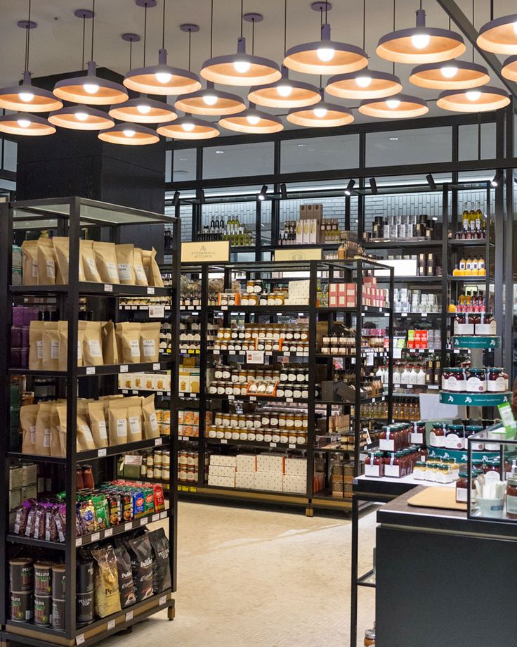 a store filled with lots of shelves and lights