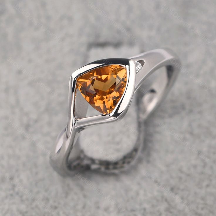 Ring details metal: silver/14k white(rose/yellow) gold center stone: trillion shape 6*6mm (0.84ct) citrine accent stone: cz NOTE: if it is silver or white gold, it will be get plated with rhodium Customization is available you can change, add or remove any parts of the ring if you have good idea. I can add special engraving inside the shank of the ring by free (words, date, simply simbles and so on) too. I am happy to help out or make any adjustments to your order if you have a special request. Trillion Ring, November Birthstone Ring, Citrine Ring, November Birthstone, Rose Yellow, Star Ring, Pretty Rings, Birthstone Ring, Ring Box