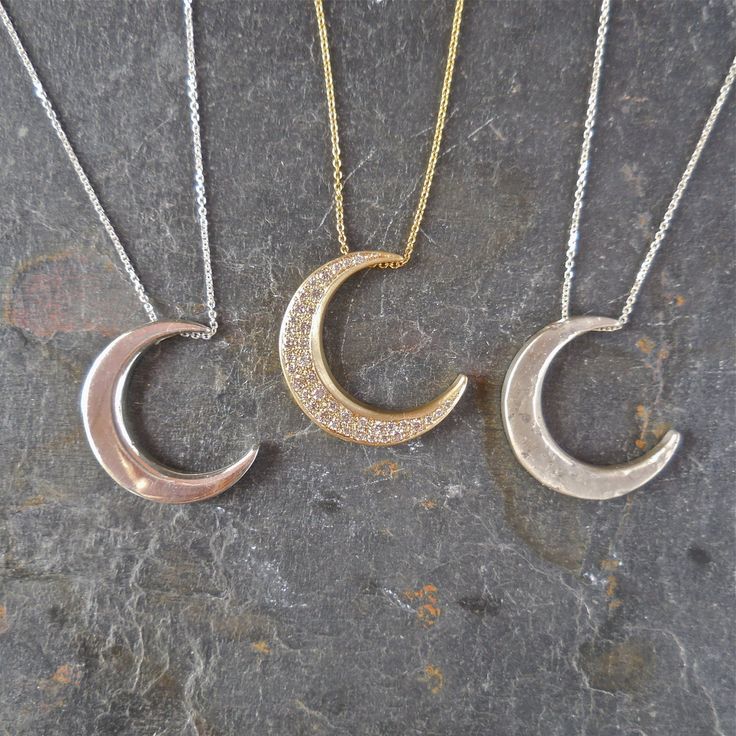 "This unique crescent moon phase pendant is available in silver or 14 k gold. So beautiful polished but equally stunning hand-finished matte, hammered or have it encrusted with diamonds. A focal piece that can be stacked with smaller pendants. It's a slide providing space for a pendant to fit into the opening. We've paired it with our bezel set moonstone. crescent moon 24 millimeters long x 19 mm wide or/ almost 1\" long x 3/4\" wide 14k solid gold or sterling silver pave Diamond encrusted Cresc Luxury Sterling Silver Moon Charm Jewelry, Luxury Sterling Silver Jewelry With Moon Charm, Luxury Sterling Silver Crescent Necklace, Elegant Diamond Sun And Moon Jewelry, Elegant Diamond Jewelry With Sun And Moon Design, Luxury Silver Crescent Jewelry, Moon Shaped Sterling Silver Jewelry With Diamond Accents, Celestial Crescent Diamond Jewelry, Silver Crescent Necklace Fine Jewelry