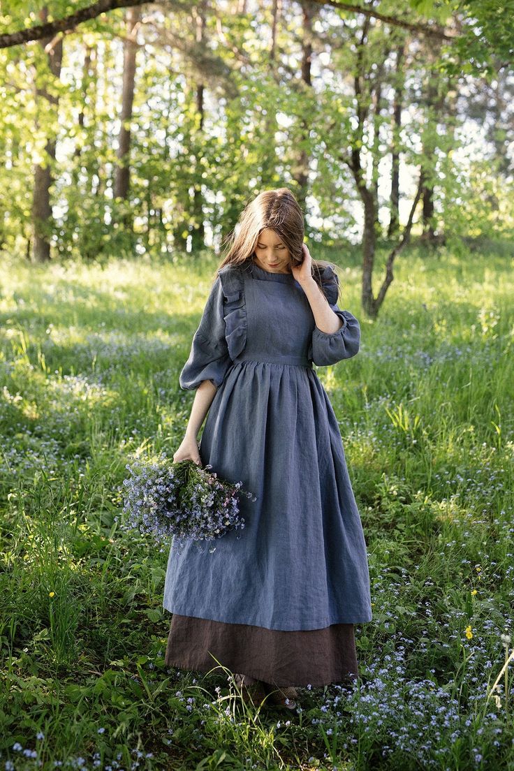 Victorian style apron with flutter sleeves is made from 100% soft and washed linen. Details: - Composition: 100% Oeko-Tex certified linen - Colour: dusty blue - Cross back - Length - 124 cm (49 inches) - Adjustable with buttons - Size: One size - Light weight linen - Linen care: machine wash gentle; tumble dry low, ironing optional - The price is for one pinafore dress, other pictured items are not included Measurements: Length from waist down: 80 cm (31,4 in) Chest width: 24 cm (9,4 in) without Linen Pinafore Apron, العصور الوسطى, Linen Pinafore, Apron For Women, Pinafore Apron, Cottagecore Outfits, Cottagecore Fashion, Aprons Vintage, Vintage Mode