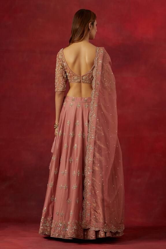 Dusty pink chanderi silk woven lehenga with an attached cancan, hand embroidered floral buttis with aari, sequins and cutdana. Comes with matching embroidered padded net blouse and  scalloped work dupatta. - Aza Fashions Pink Raw Silk Pre-draped Saree With Dupatta, Pink Raw Silk Choli For Navratri, Pink Dola Silk Chandbali Lehenga, Silk Lehenga In Pink With Traditional Drape, Pink Tissue Silk Choli With Traditional Drape, Anarkali Style Pink Raw Silk Palazzo Set, Pink Tissue Silk Lehenga For Reception, Pink Palazzo Set With Unstitched Blouse For Festivals, Pink Tissue Silk Lehenga With Unstitched Blouse