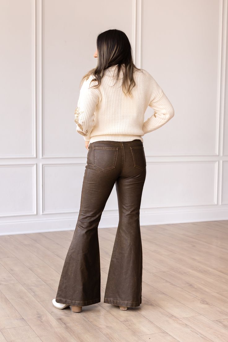 These bellbottoms are not just pants; they are a statement piece. Pair them with a flowy blouse, a tucked-in tee, or a tailored blazer – the styling possibilities are endless.Model & Fit Model: Maggie ( 5'5 and Size 6 or S) Fitted through waist and hips Stretch: No Zipper Fly Light distressing throughout for a more worn look Flare Leg High rise: 11.5" Inseam: 32" Fabric & Care Material: 100% PU Leather Care Instructions: Wash Cold, Dry Flat Manufactured overseas Non-stretch Flared Hem Bottoms For Fall, Fall Wide Leg Stretch Pants With Flared Hem, Stretch Wide Leg Pants With Flared Hem For Fall, Stretch Wide Leg Pants With Flared Hem, Fitted Wide Leg Pants For Date Night In Fall, 70s Inspired Fitted Flare Jeans For Spring, Trendy Brown Flare Jeans For Fall, 70s Inspired Fall Flare Jeans, Brown Flare Work Pants