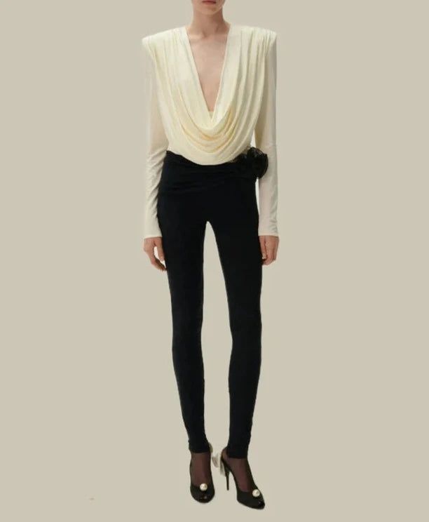 The Hot Fashionista Myra Long Sleeve Draped Blouse is a sophisticated and elegant piece that combines classic design elements with modern flair. This blouse is perfect for both professional and social settings, offering versatility and style. Draped Design: Elegant Drape: The Myra Blouse features a beautifully draped front that creates a soft, flowing silhouette. This design element adds a touch of sophistication and elevates the overall look of the blouse. Flattering Fit: The draped front not only adds visual interest but also provides a flattering fit that enhances the body's natural curves. It creates a polished and graceful appearance. Long Sleeves: Classic Elegance: The long sleeves of the blouse contribute to its classic elegance, making it suitable for various occasions, from office Draped Blouse, Designer Drapes, Natural Curves, Draped Fabric, Slim Fit Pants, Aaliyah, Outerwear Sweater, Tailored Trousers, Look Chic