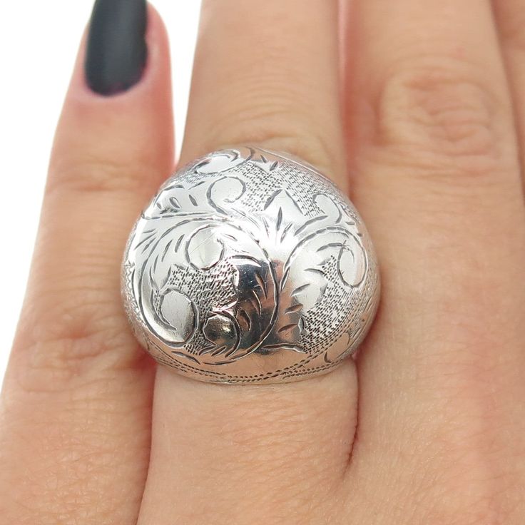 Great vintage condition.  925 Sterling Silver Vintage Siam Engraved Floral Dome Ring Size 6  Weight: 8.6g   WELCOME TO PAWN SHOP We are an actual pawn shop and have been in business for over 25 years. Since 1990, our establishment has been serving a variety of clients by providing them with short term cash solutions and options of liquidity regarding their treasured heirlooms. Acknowledging that today′s customers are very sophisticated and are looking for a variety of investments, our acquisitio Victorian Silver Signet Ring With Polished Finish, Antique Sterling Silver Engraved Ring With Intricate Design, Silver Victorian Signet Ring With Polished Finish, Heirloom Silver Dome Ring, Antique Engraved Ring With Intricate Design In Sterling Silver, Silver Heirloom Dome Ring, Round Shape, Antique Stamped Sterling Silver Rings, Vintage Sterling Silver Engraved Ring With Stamped Details, Vintage Sterling Silver Engraved Stamped Ring