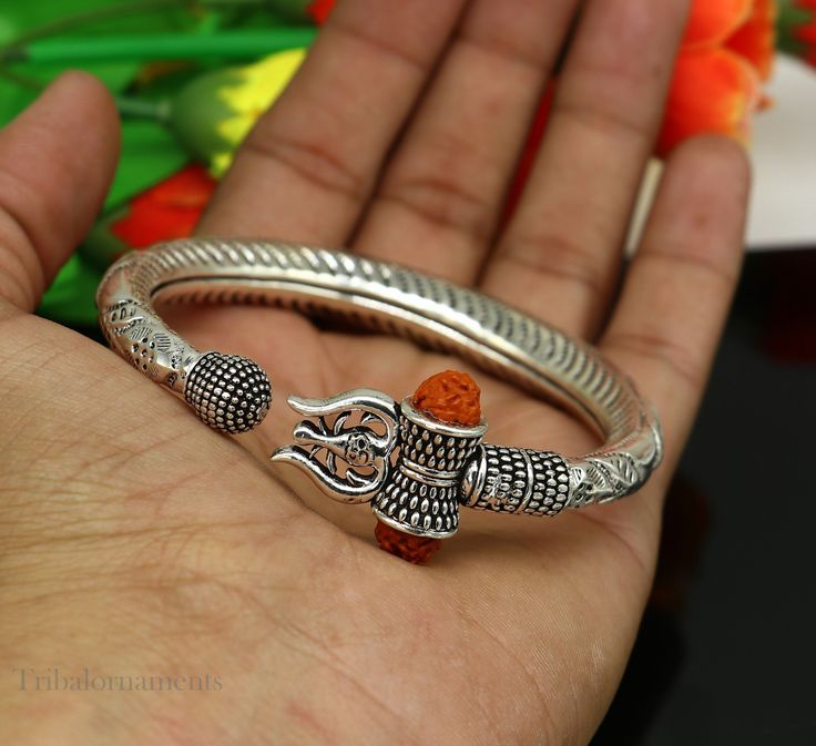 Amazing handcrafted unique designer work 925 sterling silver vintage design custom made oxidized silver personalized unisex gifting jewelry from India. Metal-925 sterling silver. Item type-Bangle /bracelet/ Kada. Weight-42.870 grams. Size-2-8 (2.5 inches inner diameter)We can easily adjust by twisting it for bigger size. Width-1.0 centimeters stamped- 925. Finish-Oxidized. Makes excellent gifting for birthday, mother's day, father's day, Christmas day,valentinesday, wedding, anniversary gifts Shiva Trident, Handmade Bangle Bracelets, Oxidized Silver, Unique Designers, Lord Shiva, Bangle Bracelet, Vintage Design, Handmade Silver, Wedding Anniversary