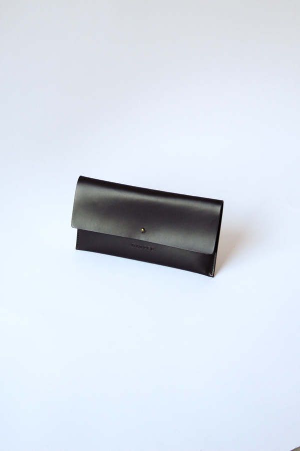 Harper    the wallet for those who love a little flexibility. carry the outer piece as a clutch tuck the inner cardholder in a bag as a wallet or wear them together.    the design includes two parts that can be used together or separately. the outer envelope enclosure features an elegant swooped detail our signature heat embossed logo and a brass closure stud. the inner cardholder includes six card slots on one side and a zipper coin pocket on the reverse. fits a cellphone and cash behind the inner cardholder to make this an all-in-one design.    measures 8 ⅛" wide and 4 ⅛" tall.    designed to become a modern heirloom all harper the label pieces are made without compromise.    our leather is vegetable tanned with organic matter and is certified chrome-free and non-toxic by the leather wor Organic Matter, Embossed Logo, Vegetable Tanned Leather, One Design, Clutch Wallet, A Bag, Leather Working, The Label, Card Slots