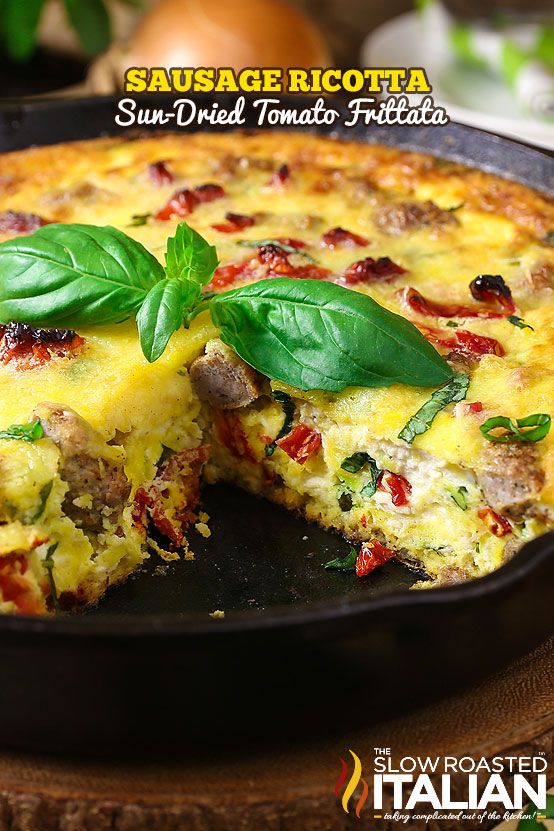 a close up of a pizza in a pan on a table