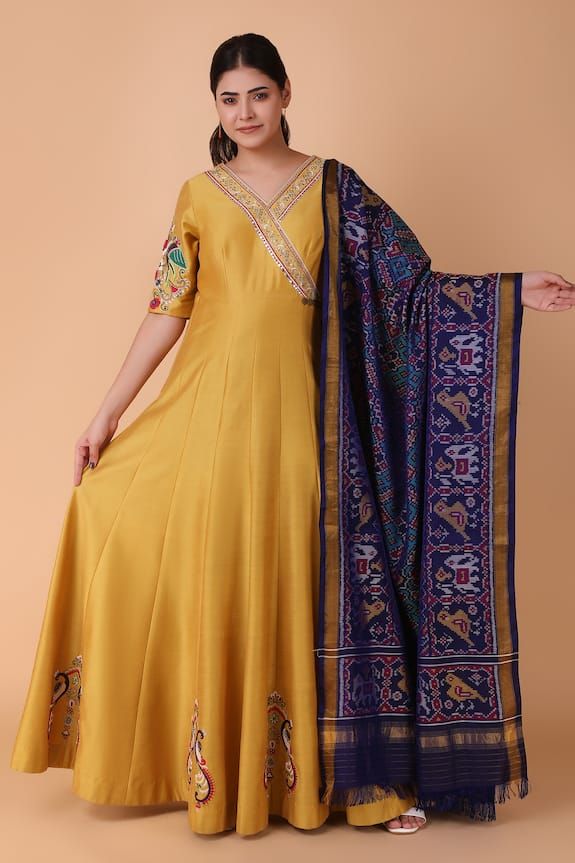 Mustard yellow floor length anarkali with placement floral, twin peacock motif embroidery using pearl, sequins. Paired with a blue dupatta with all over ikat pattern, cutdana and gota patti. - Aza Fashions V Neck Anarkali, Yellow Floor, Anarkali With Dupatta, Blue Dupatta, Peacock Motif, Placement Embroidery, Floor Length Anarkali, Motif Embroidery, Embroidered Anarkali