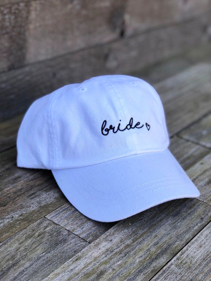 Ready to ship For the bride 🖤 Great for bachelorette parties! Embroidered white dad hat adjustable in the back with a fabric strap One size fits most White Embroidered Trucker Hat With Curved Brim, Adjustable White Dad Hat With Curved Bill, White Adjustable Dad Hat With Curved Brim, White Adjustable Dad Hat With Curved Bill, White Embroidered Dad Cap, Adjustable White Dad Hat, White Wedding Hats One Size Fits Most, White Wedding Hats, One Size Fits Most, White Adjustable Hat For Bachelorette Party