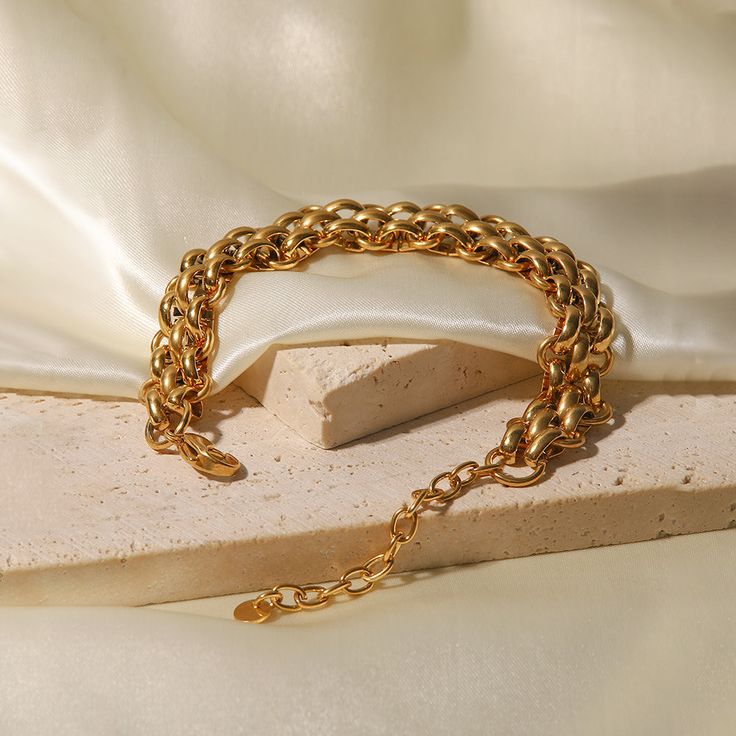 Introducing the Charlotte Bracelet - the ultimate accessory that embodies timeless elegance and luxury. Crafted with 18k gold plating, this bracelet radiates an opulent charm that is sure to elevate your style game to new heights. The Charlotte Bracelet is designed to last and resist the effects of daily wear and tear. It is both water and tarnish-resistant, ensuring that it retains its flawless finish even after extended use. So you can wear it with confidence, whether you're out running errand Jewelry Girlfriend, Fashion Jewelry Necklaces Gold, Real Gold Bracelet, Baguette Bracelet, Stile Hip Hop, Prom Accessories, Twisted Bracelet, Style Hip Hop, Anniversary Jewelry