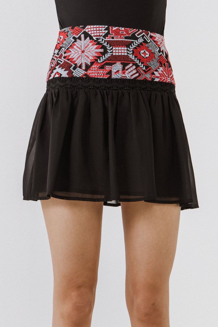 Maximize your style with the Dorian Embroidered Mini Skirt. This adorable skirt features an exquisitely embroidered yoke for a unique and chic look, while the fit & flare silhouette flatters your curves. A must-have piece with its mini length, this skirt can be easily dressed up or down and requires a gentle hand wash. Add this modern-vintage piece to your wardrobe and stand out from the rest. Embroidered yoke Fit & flare silhouette Mini length Hand wash cold Do not bleach Do not tumble dry Iron Black Fitted Bohemian Mini Skirt, Fitted Floral Embroidered Skirt, Casual Mini Skirt With Embroidered Hem, Summer Skirt With Embroidered Hem, Black Gathered Skort For Summer, Embroidered Black Skirt For Summer, Black Embroidered Flowy Skirt, Fitted Embroidered Black Mini Skirt, Fitted Embroidered Mini Skirt