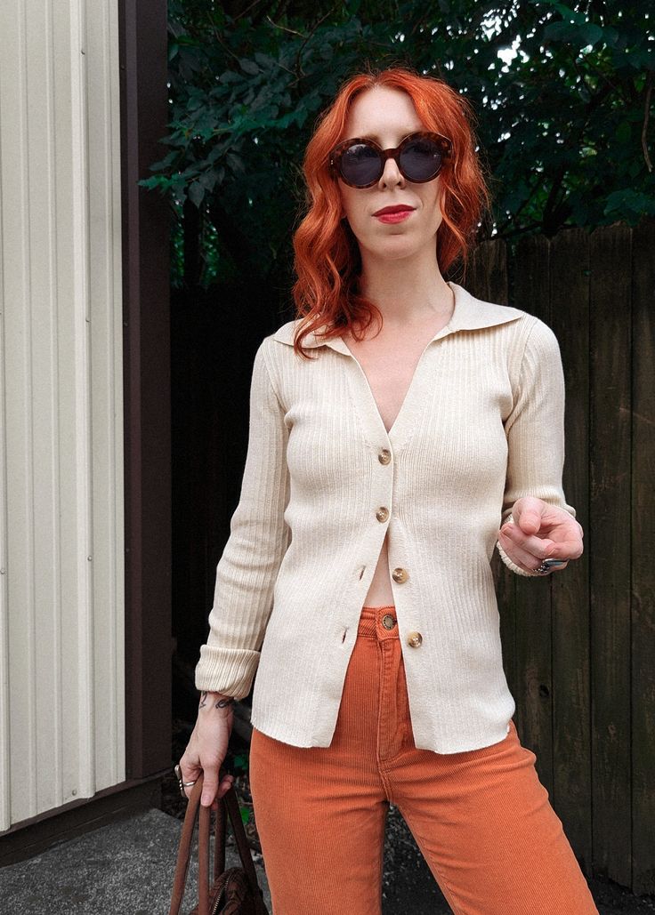 Buttery soft and stretchy rib knit top featuring a collared v-neckline, long sleeves, and a full button front. Light stone (cream) colorway. Love this worn with the sleeves rolled a bit and paired with jeans or cords for a classic '90s look! Features: Rib knit top Fitted style V-neckline Ribbed collared Long sleeves Button front with tortoise buttons Light stone (cream) colorway Has lots of stretch Brand & Fabric Content: Brand: Glamorous Materials: 48% viscose 28% poly 24% polyamide | Regular c Ankle Length Skirt, 90s Looks, Rib Knit Top, Rib Knit Cardigan, Skirt Jumpsuit, Fitted Style, Cardigan Top, Dress Pant, New Outfits