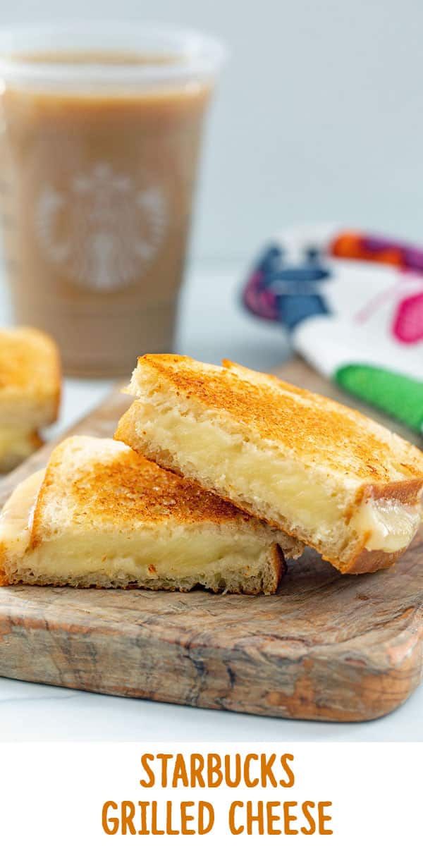 two grilled cheese sandwiches on a cutting board with a cup of coffee in the background