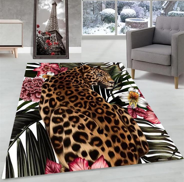 a living room with a leopard and flowers rug on the floor next to a chair