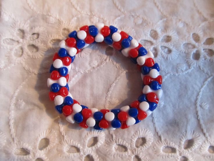 This is a Girls Beaded Bracelet.  It has red, white, and blue tri beads. It was made with .8mm sturdy stretch string. I tie it several times to prevent breakage. It fits girls ages 4-6. It stretches to fit the wrist. It would make a cute gift for a little girl for the Fourth of July. It would make a cute gift for a little girl's Birthday. All items are ready to be shipped I do combined shipping. Items ship in 2-5 business days. Check out more items at: http://www.etsy.com/shop/MesheleCrafts http Patriotic White Stretch Bracelet With Round Beads, Patriotic White Stretch Bracelet, Bracelets Kids, Patriotic Bracelet, Angel Bracelet, Kids Bracelets, Bone Beads, Red White And Blue, Bracelet Gift