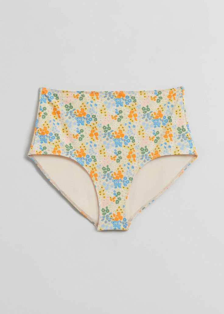 High waist bikini bottoms featuring an all-over floral pattern. Multicolor Floral Print Bottoms For Sunbathing, Beachwear Bottoms For Pool In Spring, Floral Print Beachwear Bottoms For Spring, Spring Beachwear Bottoms For Pool, Spring Beachwear Bottoms For The Pool, Stretch Floral Print Bottoms For Pool, Floral Print Stretch Bottoms For Pool, Beachwear Multicolor Floral Print Bottoms, Multicolor Floral Print Bottoms For Beachwear