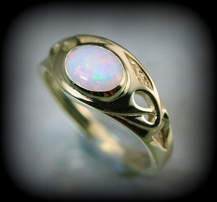 You are a big fan of art nouveau like i am, you'll love this piece ; there is elegancy and a flair of mystery with this style that makes it unique. Here is a ring i create recently to honor this style. The ring is made in solid 10 k or 14 k gold with a beautiful opal. You can order with another stone by sending me a message.  ring dimensions on the top : 10 mm band dimensions : 2 mm Because the environment means a lot to me just like you, all my jewelry is sent with the recyclable material, such as paper bags and boxes of jewels made with 100% recycled cardboxes made with 77% post-consumer fiber and 23% pre-consumer fiber. Also I use small biodegradable plastic bags. I print your invoices on ecological certified paper, earth choice 14k Gold Art Deco Jewelry, Art Deco 14k Gold Promise Ring Jewelry, 14k Gold Art Deco Promise Ring, 14k Gold Art Deco Promise Ring Jewelry, Unique 14k Gold Moonstone Ring Gift, Elegant Opal Cabochon Jewelry, Elegant Gold Opal Ring, Elegant Opal Jewelry With Cabochon, Antique Oval Opal Ring As Gift