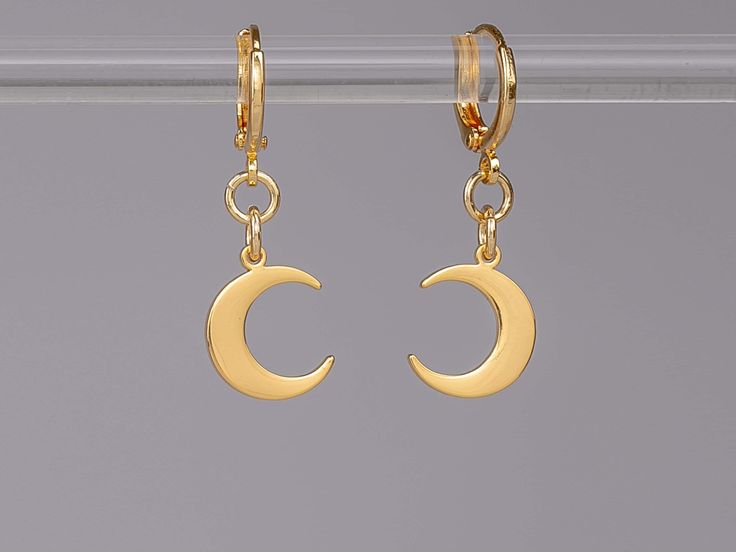 Tiny waxing and waning moon huggies 🌙 1 Pair (2 Earrings) Crescent Moon Earrings 🌙 1.375 inches total length 🌙 Huggie lever-back closure 🌙 18k gold plated brass 🌙Original design by Shabnam Q. 🌙Don't have your ears pierced? All earrings are customizable to be clip-on! Just send me a message ☺ Crescent Single Huggie Earring As Gift, Crescent-shaped Single Huggie Earring As Gift, Minimalist Gold Crescent Cartilage Earrings, Crescent Shaped Single Huggie Earring Gift, Celestial Huggie Earrings With Moon Charm, Gold Crescent Huggie Earrings, Gold Crescent Huggie Earrings For Gift, Elegant Huggie Earrings With Moon Charm, Dainty Huggie Earrings With Moon Charm